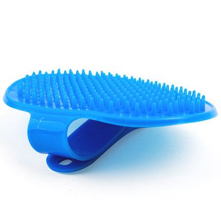 Side view of blue pet bath brush showing bristles and strap